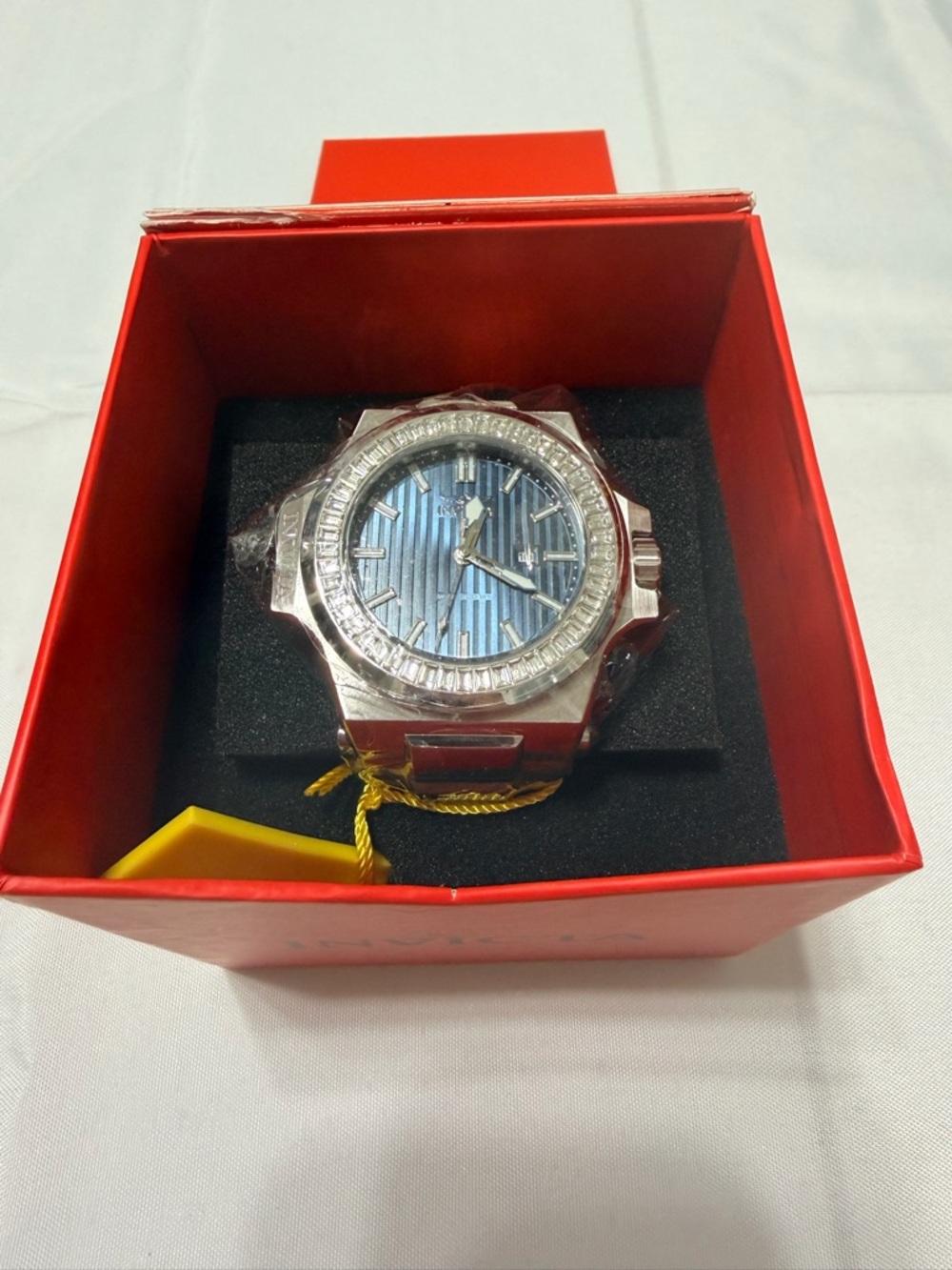 Invicta Men’s Akula 58mm silver watch with silver bracelet.